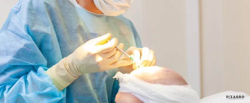 PHR - A hair surgeon performing a hair transplant