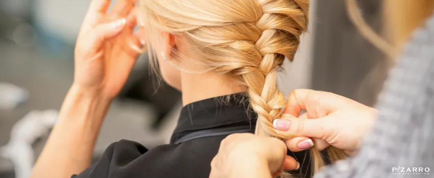 PHR - Hairdresser braiding a woman's hair