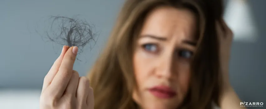 PHR - Sad woman holding lost hair