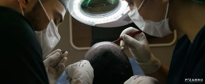 PHR - Two surgeons performing hair transplants